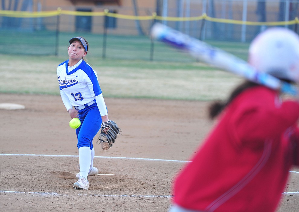 Prescott's Makayla Reyes delivers a pitch as the Badgers host Seton Catholic on a blustery day Friday, March 8, 2019. Les Stukenberg/Courier)