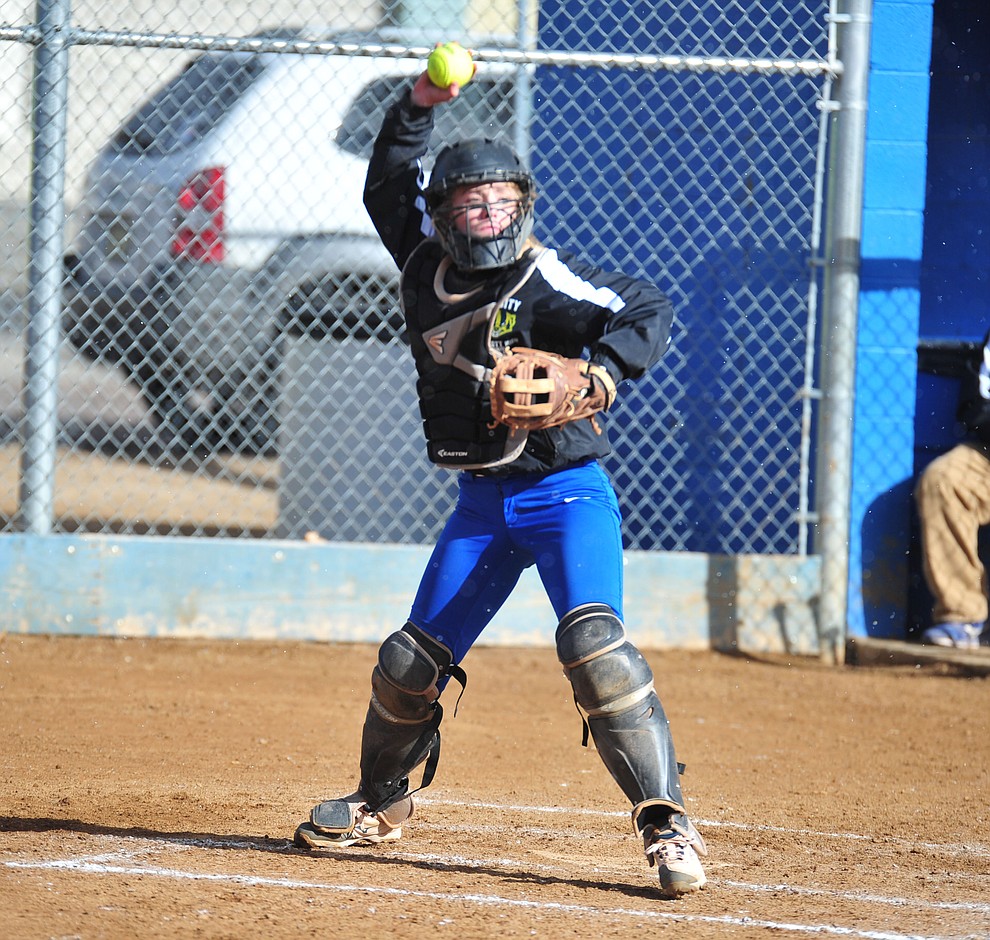 Prescott's Danner Cozens makes the throw to first as the Badgers host Seton Catholic on a blustery day Friday, March 8, 2019. Les Stukenberg/Courier)