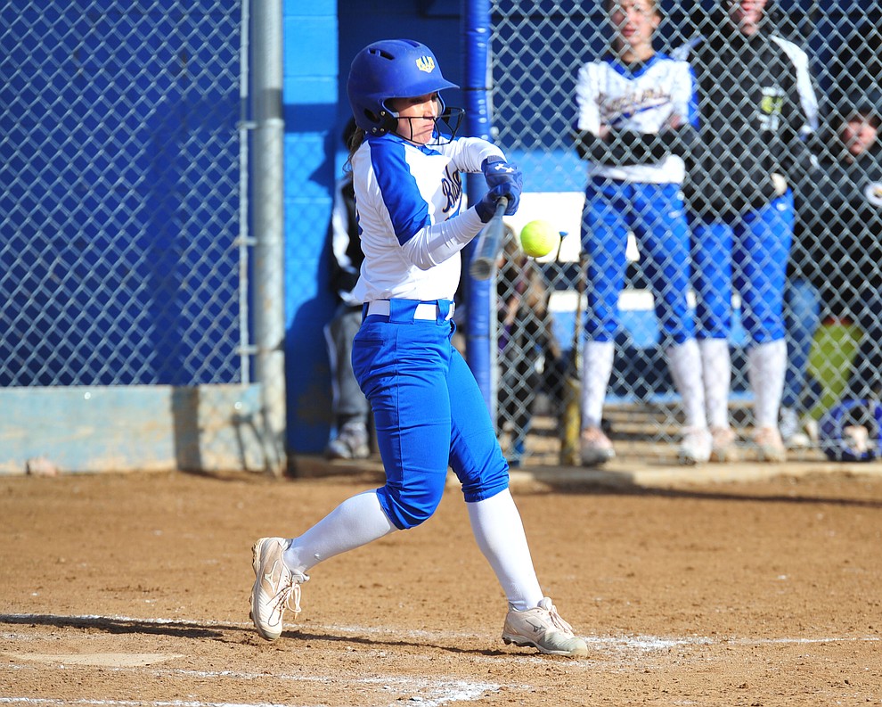 Prescott's Makayla Reyes hits a solo home run in the first inning as the Badgers host Seton Catholic on a blustery day Friday, March 8, 2019. Les Stukenberg/Courier)