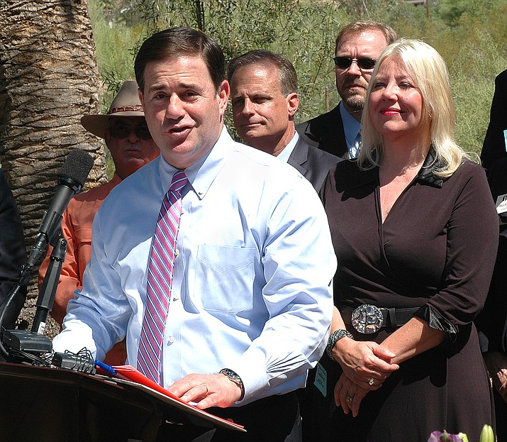 In this file photo, Gov. Doug Ducey talks after signing legislation stripping the right of cities to regulate vacation rentals back in June 2016. The law overruled any existing or future city ordinances that limit short-term rentals, leaving cities with the power to regulate only things like noise and parking rules. Now lawmakers are moving to curb some of the abuses that were created when they agreed three years ago to let people rent out their own homes for overnight guests. HB 2672 would prohibit homeowners from allowing properties to be used for special events. (Howard Fischer/Capitol Media Services file)