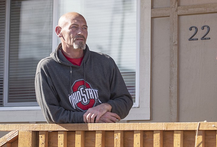 George Schneider, a U.S. Army Gulf War veteran, stands on his porch at the Eureka Apartments, on Thursday, March 7, 2019, in Prescott. Schneider has lived at the complex for two years and likes the location for easy access to the VA Hospital and other services in Prescott.  (Les Stukenberg/Courier)