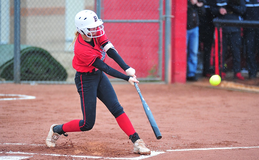 Bradshaw Mountain's Kassidy Outlaw drives a single as the Bears take on Coconino in a steady rainfall, Monday, March 11, 2019, in Prescott Valley. Les Stukenberg/Courier)
