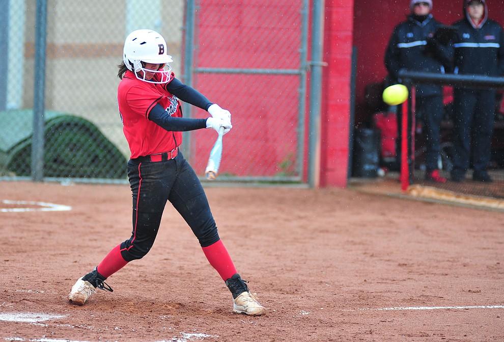 Bradshaw Mountain's Layla Stouder drives a souble to the outfield as the Bears take on Coconino in a steady rainfall, Monday, March 11, 2019, in Prescott Valley. Les Stukenberg/Courier)