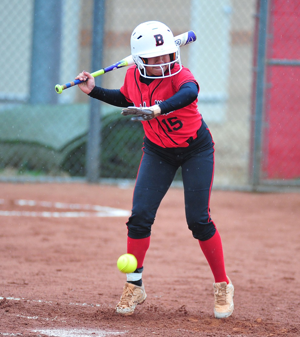 Bradshaw Mountain's Aniessa Ramirez gets hit by a pitch as the Bears take on Coconino in a steady rainfall, Monday, March 11, 2019, in Prescott Valley. Les Stukenberg/Courier)