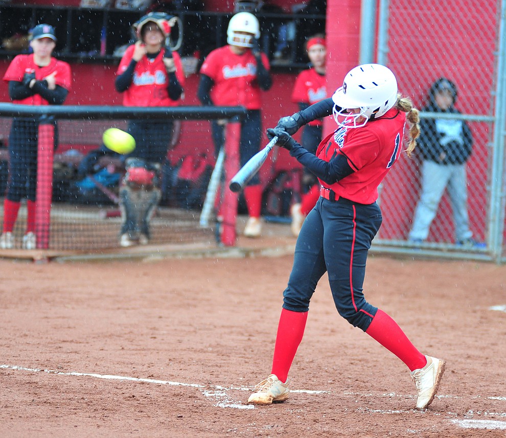 Bradshaw Mountain's Jacie Hambrick drives a double to right field as the Bears take on Coconino in a steady rainfall, Monday, March 11, 2019, in Prescott Valley. Les Stukenberg/Courier)