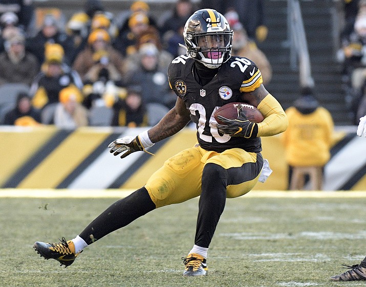 Pittsburgh Steelers running back Le'Veon Bell carries the ball against the Jacksonville Jaguars during the second half of an AFC playoff game Sunday, Jan. 14, 2018, in Pittsburgh. (Don Wright/AP, File)