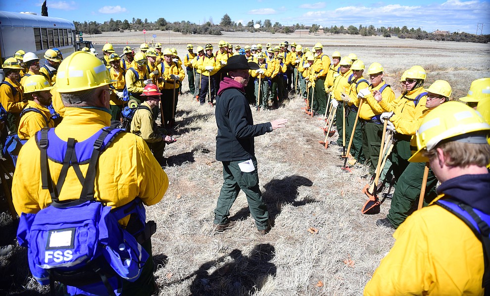 Todd Able gives a briefing to the Arizona Wildfire & Incident Management Academy's 92 students in four S130/190 Basic Wildland Firefighting classes go out on their field day at Embry Riddle Aeronatical University, Wednesday, March 13, 2019, in Prescott. (Les Stukenberg/Courier)