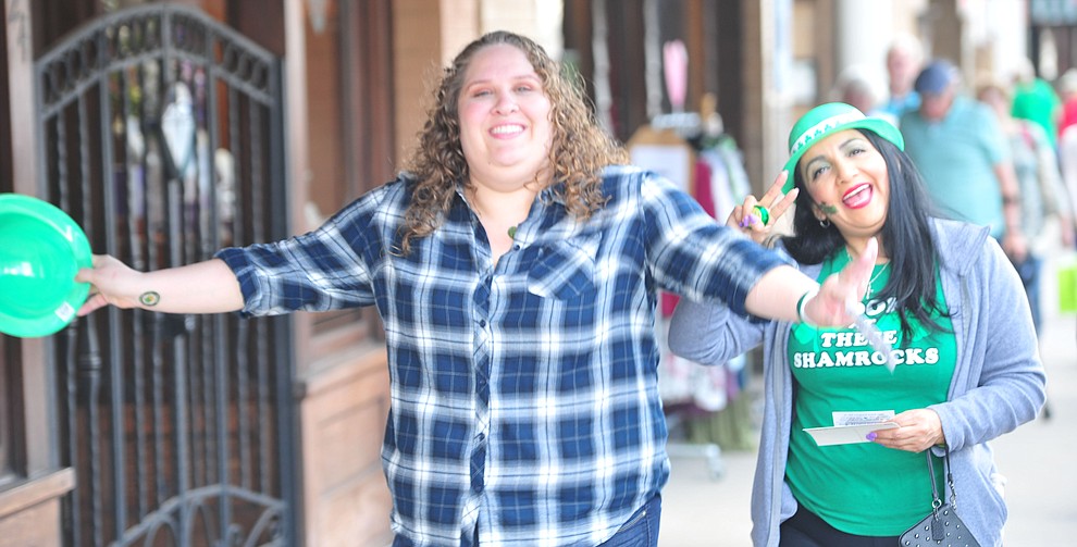 Christina Guzman and Maribel Saucedo head down Whiskey Row during the 2019 St. Patrick's Day Pub Crawl Sunday, March 17, 2019 in downtown Prescott. (Les Stukenberg/Courier)