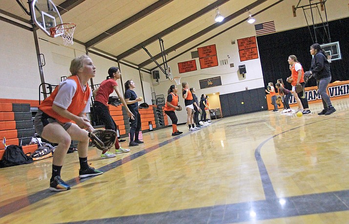 The Lady Vikes play soft toss during an indoor practice March 14. (Wendy Howell/WGCN)