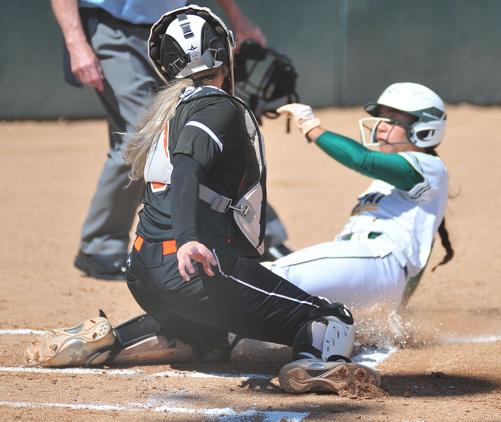 Yavapai's Neenah Pangilinan gets tagged out at home as the Roughriders take on the Chandler Gilbert Coyotes Tuesday, March 19, 2018 in Prescott.