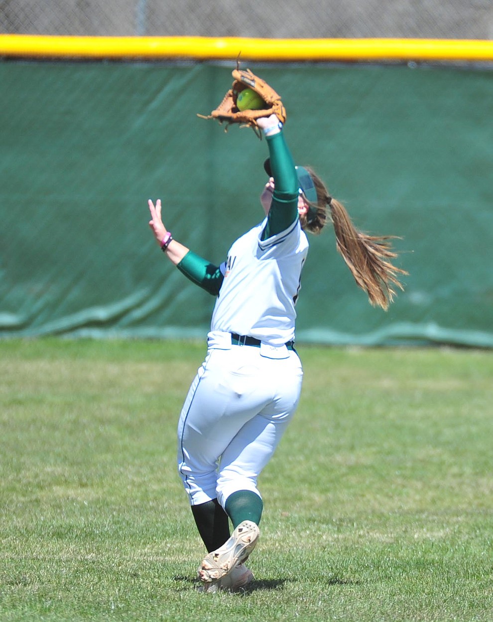 Yavapai's Brianna Griffiths makes the play in shallow left field as the Roughriders take on the Chandler Gilbert Coyotes Tuesday, March 19, 2018 in Prescott.