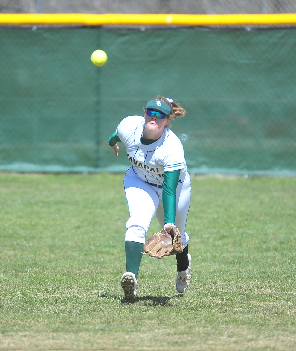 Yavapai's Meredith Clark goes for the catch in center field as the Roughriders take on the Chandler Gilbert Coyotes Tuesday, March 19, 2018 in Prescott.