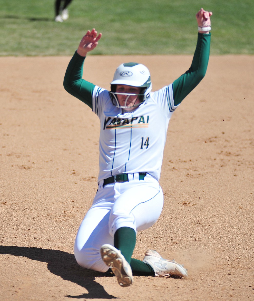 Yavapai's Meredith Clark slides safely into third as the Roughriders take on the Chandler Gilbert Coyotes Tuesday, March 19, 2018 in Prescott.