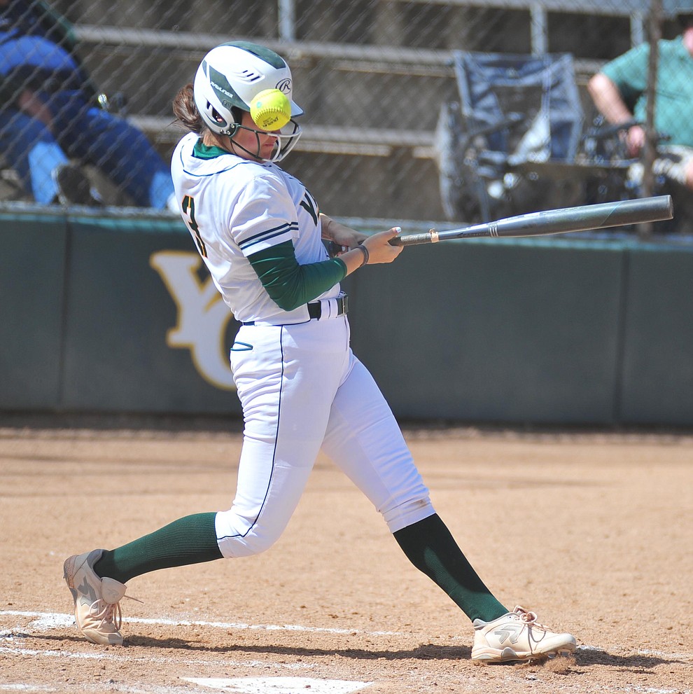 Yavapai's Jessica Giacoma takes a foul ball off her helmet as the Roughriders take on the Chandler Gilbert Coyotes Tuesday, March 19, 2018 in Prescott.