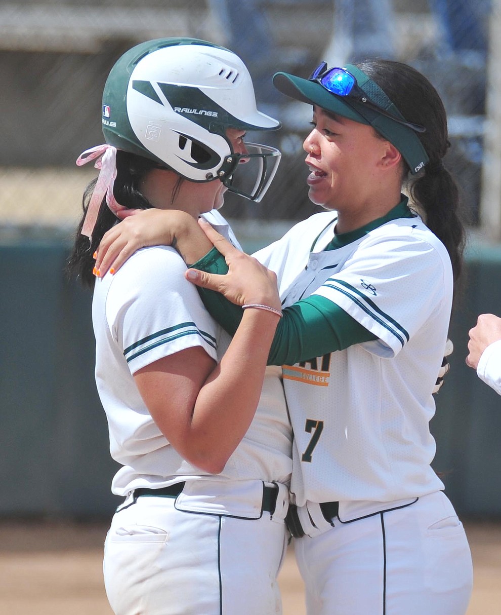 Yavapai's Kylie Brown gets congratulated by Neenah Pangilinan after Brown's two-run walk off homer in the first game of a double header against the Chandler Gilbert Coyotes Tuesday, March 19, 2018 in Prescott.