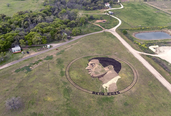 A crop art portrait of presidential candidate Beto O'Rourke is seen Tuesday, March 19, 2019 just east of Austin, Texas. Kansas artist Stan Herd is responsible for the work, which is visible to passing airplanes. He says he wants to show support for O'Rourke, who rose to prominence while trying to unseat Republican Sen. Ted Cruz in 2018. (William Luther/The San Antonio Express-News via AP)