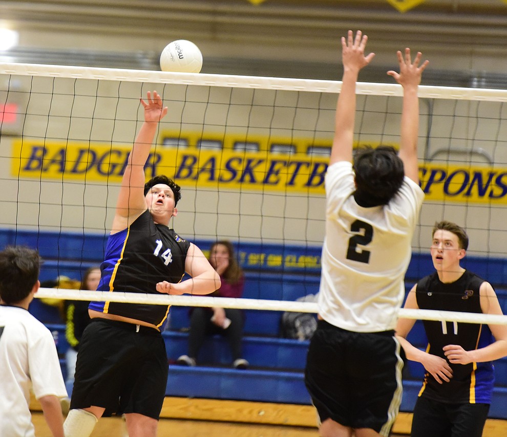 Prescott's Vincent Oldfield sends the ball across the net as the Badgers hosted Leading Edge Wednesday, March 20, 2019 in Prescott. (Les Stukenberg/Courier)
