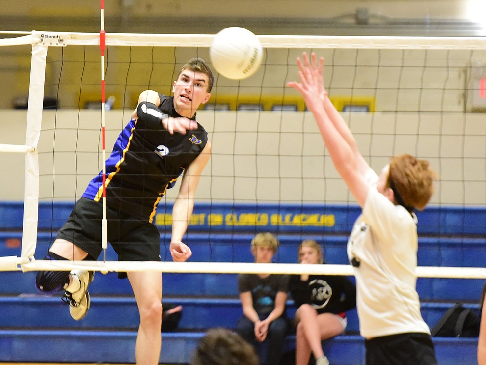 Prescott's Cole Fernandez sends a kill to the back line as the Badgers hosted Leading Edge Wednesday, March 20, 2019 in Prescott. (Les Stukenberg/Courier)