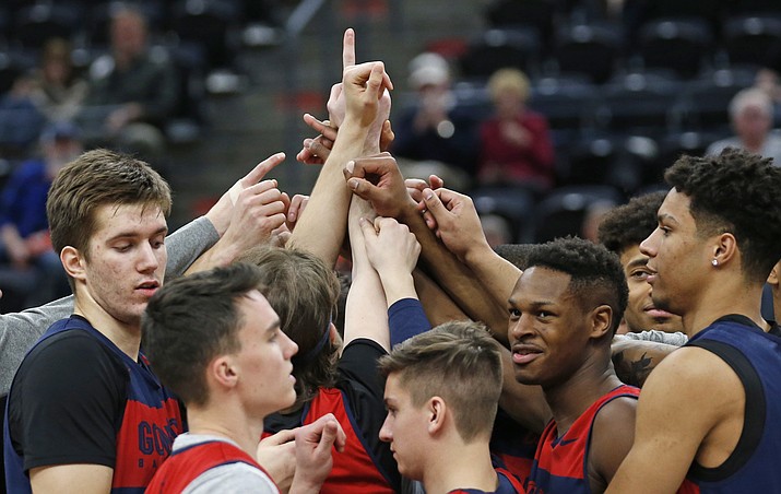 Gonzaga players huddle following practice at the NCAA men's college basketball tournament Wednesday, March 20, 2019, in Salt Lake City. Gonzaga plays Fairleigh Dickinson on Thursday. (Rick Bowmer/AP)