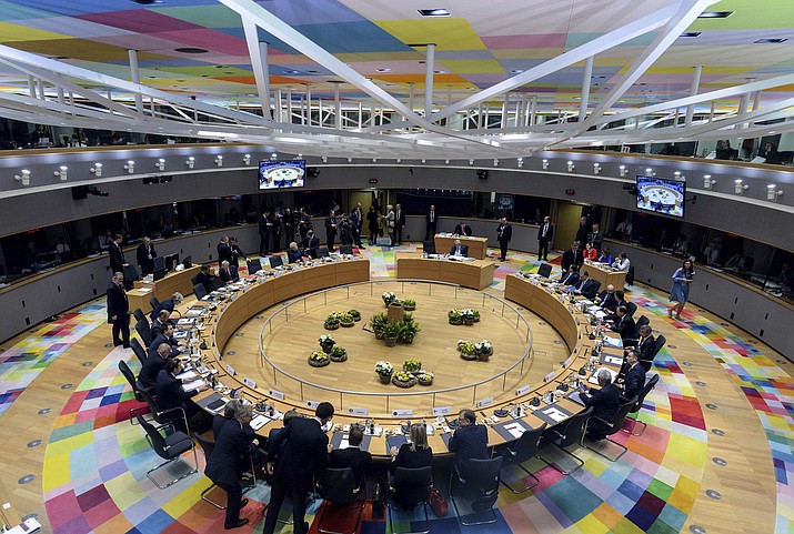 European Union leaders attend a round table meeting at an EU summit in Brussels, Thursday, March 21, 2019. British Prime Minister Theresa May is trying to persuade European Union leaders to delay Brexit by up to three months, just eight days before Britain is scheduled to leave the bloc. (Aris Oikonomou, Pool Photo via AP)