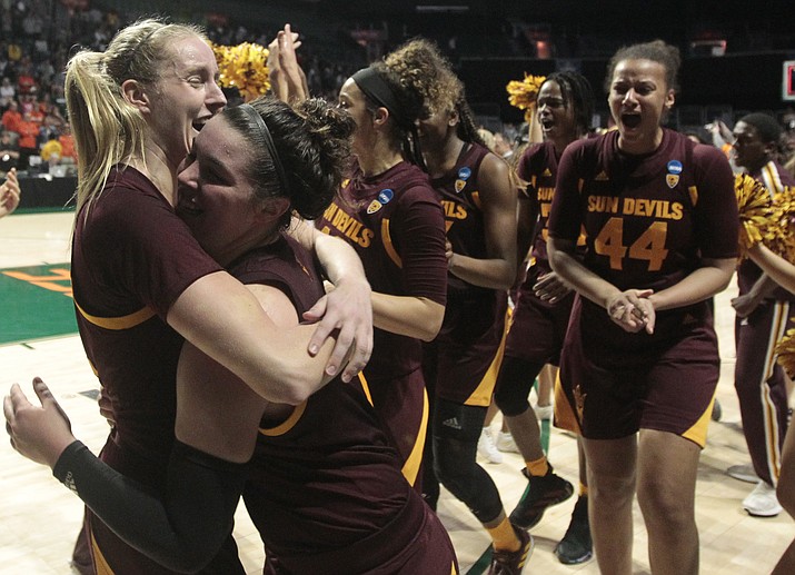 Arizona State's Courtney Ekmark, left, hugs teammate Robbi Ryan, right, after the Sun Devils defeated Miami 57-55 during a second round women's college basketball game in the NCAA Tournament, Sunday, March 24, 2019, in Coral Gables, Fla. (Luis M. Alvarez/AP)