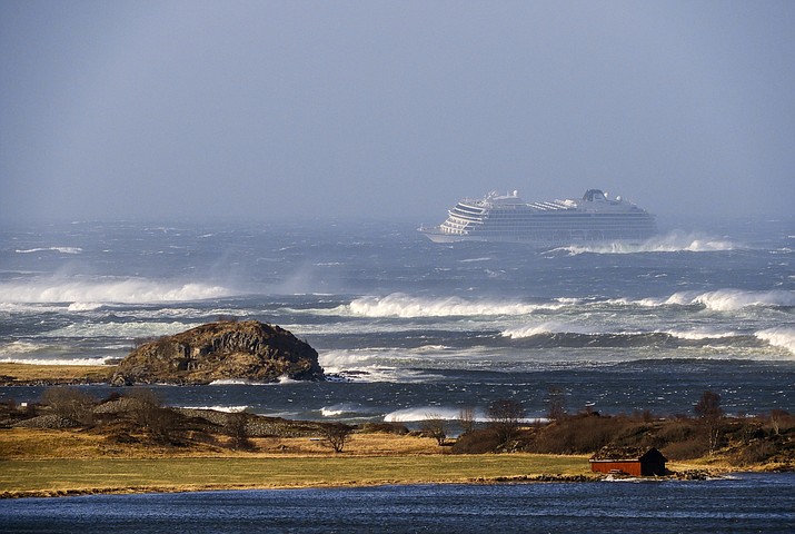 The cruise ship Viking Sky as it drifts after sending a Mayday signal because of engine failure in windy conditions near Hustadvika, off the west coast of Norway, Saturday March 23, 2019. The Viking Sky is forced to evacuate its estimated 1,300 passengers.  (Odd Roar Lange / NTB scanpix via AP)