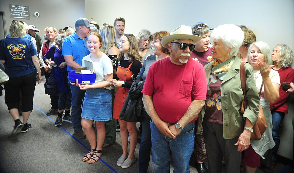 About 60 people wait in the hall with an additional 110 up at the Prescott Public Library and several hundred more Save the Dells supporters gathered outside Prescott City Hall to show their support against the planned Arizona Eco Development and annexation of some of the Granite Dells area Tuesday, March 26 in Prescott. (Les Stukenberg/Courier)