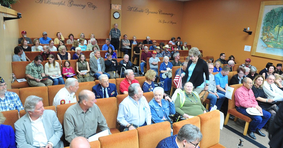 The council chambers were filled to capacity, with 60 more people in the hallway, another 110 at the Prescott Public Library and several hundred Save the Dells supporters were outside Prescott City Hall to show their support against the planned Arizona Eco Development and annexation of some of the Granite Dells area Tuesday, March 26 in Prescott. (Les Stukenberg/Courier)