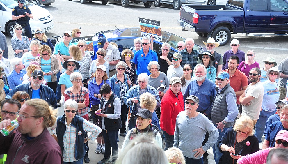 Several hundred Save the Dells supporters gather outside Prescott City Hall to show their support against the planned Arizona Eco Development and annexation of some of the Granite Dells area Tuesday, March 26 in Prescott. (Les Stukenberg/Courier)