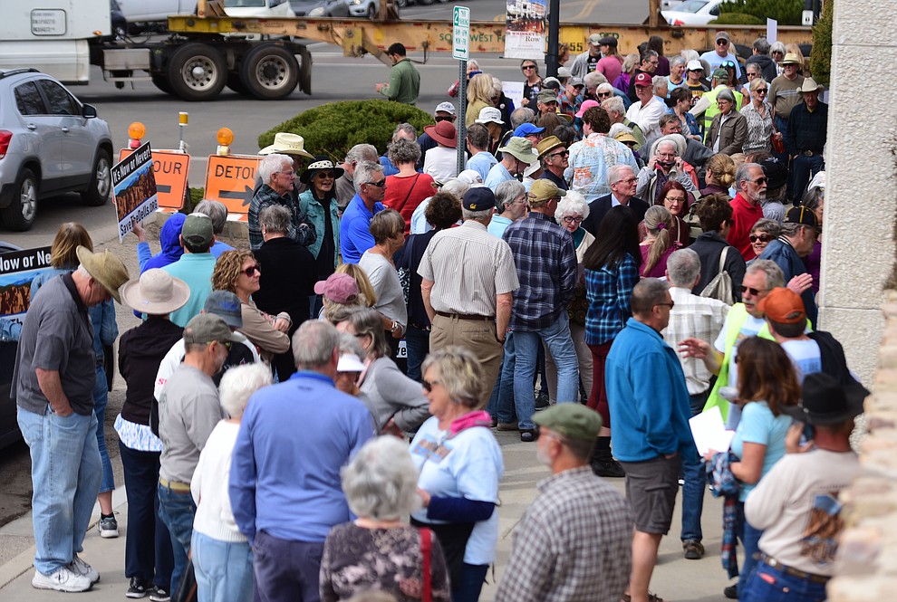 Several hundred Save the Dells supporters gather outside Prescott City Hall to show their support against the planned Arizona Eco Development and annexation of some of the Granite Dells area Tuesday, March 26 in Prescott. (Les Stukenberg/Courier)