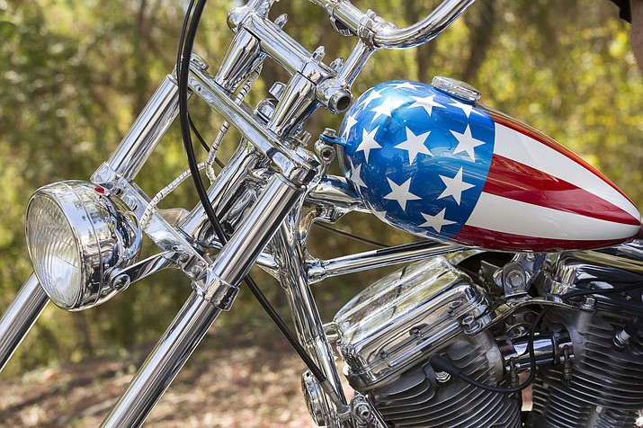 A motorcycle icon: The Captain America chopper Peter Fonda rode in “Easy Rider” shown Thursday, Sept. 4, 2014, at the Profiles in History auction house in Calabasas, Calif. (Damian Dovarganes/AP, file)