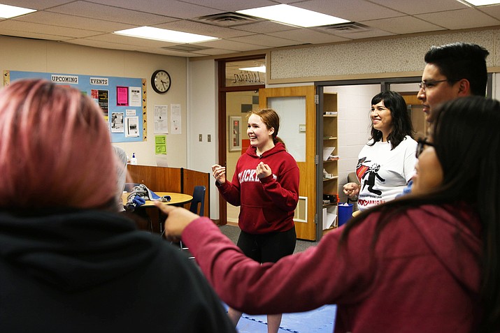 The self-defense class at Westwood High was led by Kylie Hunts-in-Winter (red sweatshirt) and Souta Calling Last, founder and executive director of indigenous Vision, a nonprofit that works to revitalize Indigenous communities. (Photo by Meg Potter/Cronkite News)