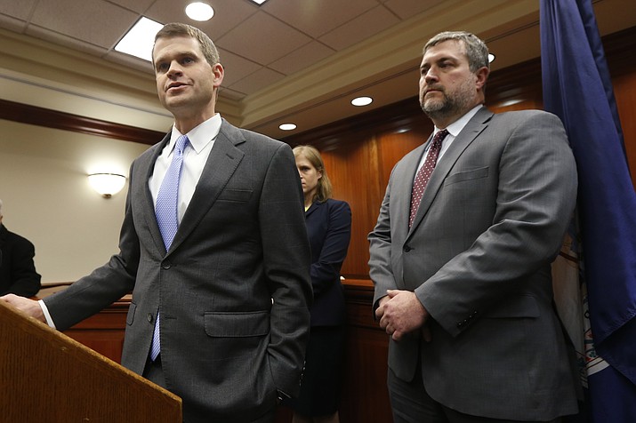U.S. Attorney Thomas Cullen, left, speaks to the media along with FBI agent James Dwyer, right, after a plea agreement with James Alex Fields who was charged with 30 counts stemming from a car attack during the Unite the Right rally in 2017, in federal court in Charlottesville, Va., Wednesday, March 27, 2019. (Steve Helber/AP)