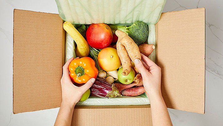 This photo provided by Philadelphia-based produce delivery company Misfits Market, shows one box of fruits and veggies customers can sign up for online. Experts say there are two basic rules to reducing household food waste: Eat what you have, and buy only what you need. Also, be willing to buy ''ugly'' fruits and vegetables -- ones that don't look perfect but are otherwise fine. (Misfits Market via AP)
