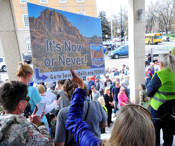 Several hundred Save the Dells supporters gather outside Prescott City Hall to show their support against the planned Arizona Eco Development and annexation of some of the Granite Dells area Tuesday, March 26 in Prescott. (Les Stukenberg/Courier)