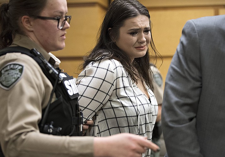Tay'Lor Smith fights back tears as she is escorted out of the courtroom in handcuffs after being sentenced at the Clark County Courthouse in Vancouver, Wash., on Wednesday, March 27, 2019. Smith pleaded guilty to pushing Jordan Holgerson off the bridge at Moulton Falls Regional Park in August. She was sentenced to two days in jail and 38 days on a county work crew. (Amanda Cowan/The Columbian via AP)