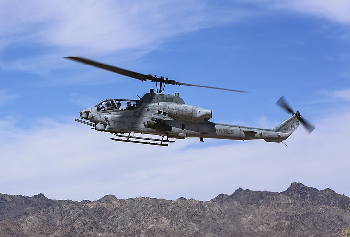 In this April 17, 2017 photo released by U.S. Marine Corps, an AH-1Z Viper prepares to land at the Chocolate Mountain Aerial Gunnery Range, Calif. A statement from the Marine Corps Air Station posted on Facebook Saturday, March 31, 2019, says two pilots have died on an AH-1Z Viper helicopter crash, while conducting a routine training mission near Yuma, Ariz. The accident occurred at about 8:45 p.m. Saturday. (Cpl. Harley Robinson/U.S. Marine Corps via AP)