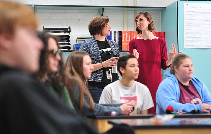 Arizona Superintendent of Public Instruction Kathy Hoffman, back right talks with counselor Alison Zyche, while she observes a junior chemistry class as she visits Northpoint Expedtionary Learning Academy Monday, April 1, 2019 in Prescott. (Les Stukenberg/Courier)