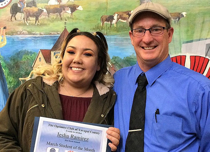 Bradshaw Mountain High School senior Iesha Ramirez and Bradshaw Principal Kort Miner pose after the Optimist Club of Yavapai County’s presentation of the Student of the Month award to Iesha at the March 28 Prescott Valley Town Council meeting. (Sue Tone/Tribune)