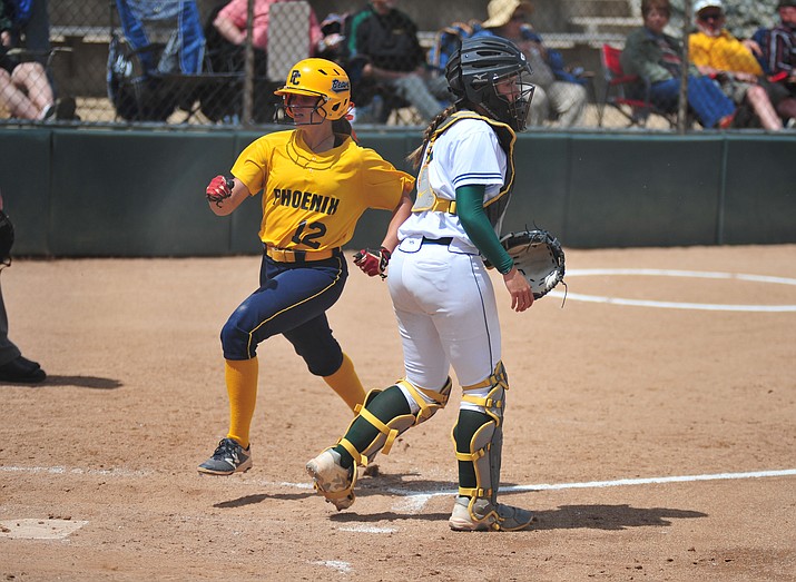 Phoenix College’s Sydnee Smith (12) crosses home plate as the Bears scored 16 unanswered runs in game one Thursday, April 4, in Prescott. (Les Stukenberg/Courier)