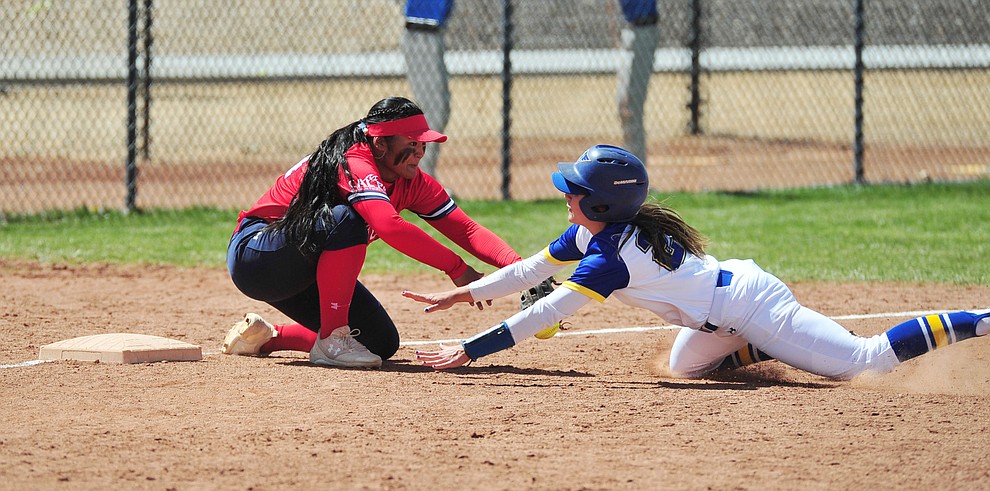 Embry Riddle's Carly Carlsen slides safely into third with a triple as the Eagles take on the University of Antelope Valley Pioneer's for the first game of a softball doubleheader in Prescott Friday, April 5. The Eagles won the game 2-0. (Les Stukenberg/Courier)