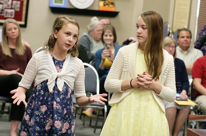 Mountain View Prep sixth graders Avery Trezise and Kenzie Fangman tell the Cottonwood-Oak Creek School Board on Tuesday that sixth graders should be part of their school’s International Baccalaureate program. VVN/Bill Helm