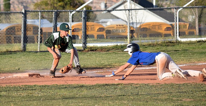 Clarkdale-Jerome seventh grader Ben Behlow prepares to tag out a Camp Verde runner on Thursday at home. VVN/James Kelley