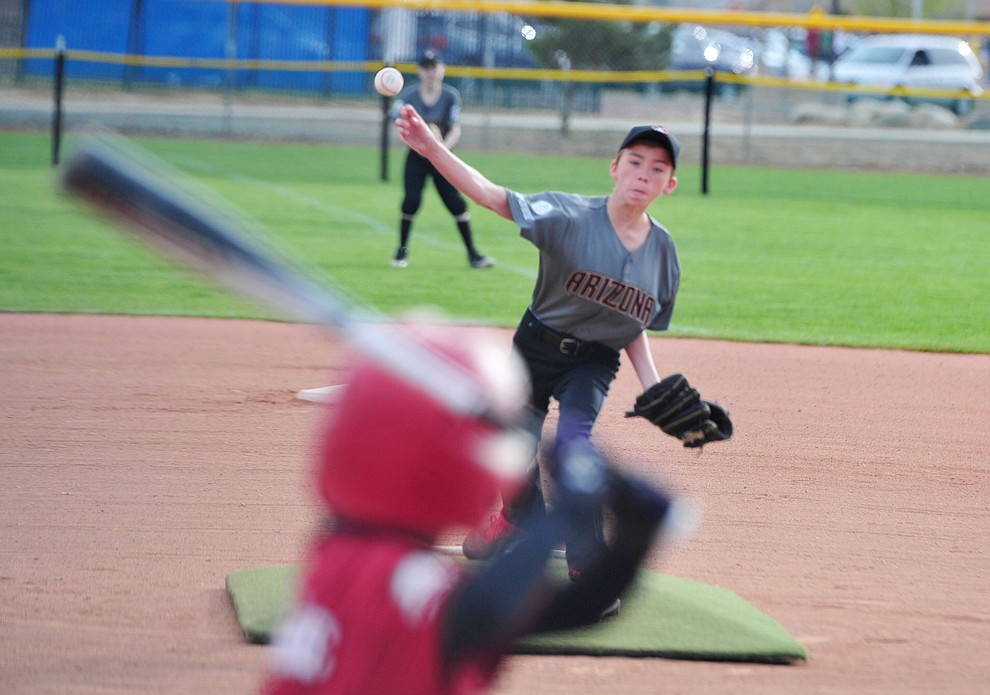 Branden Wohlrabe, from the Agua Fria league, delivers a pitch during the Prescott Valley Little League opening night Monday, April 8 at Mountain Valley Park.  (Les Stukenberg/Courier)