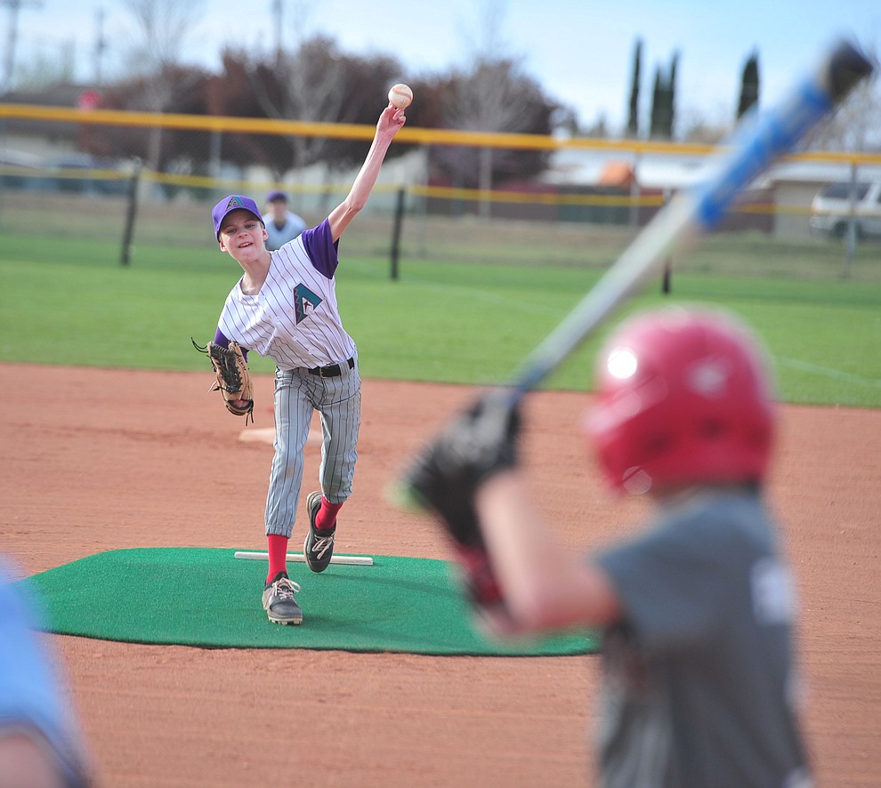 Diamondbacks Process Driven Baseball's Matt Hepperle delivers a pitch during the Prescott Valley Little League opening night Monday, April 8 at Mountain Valley Park.  (Les Stukenberg/Courier)