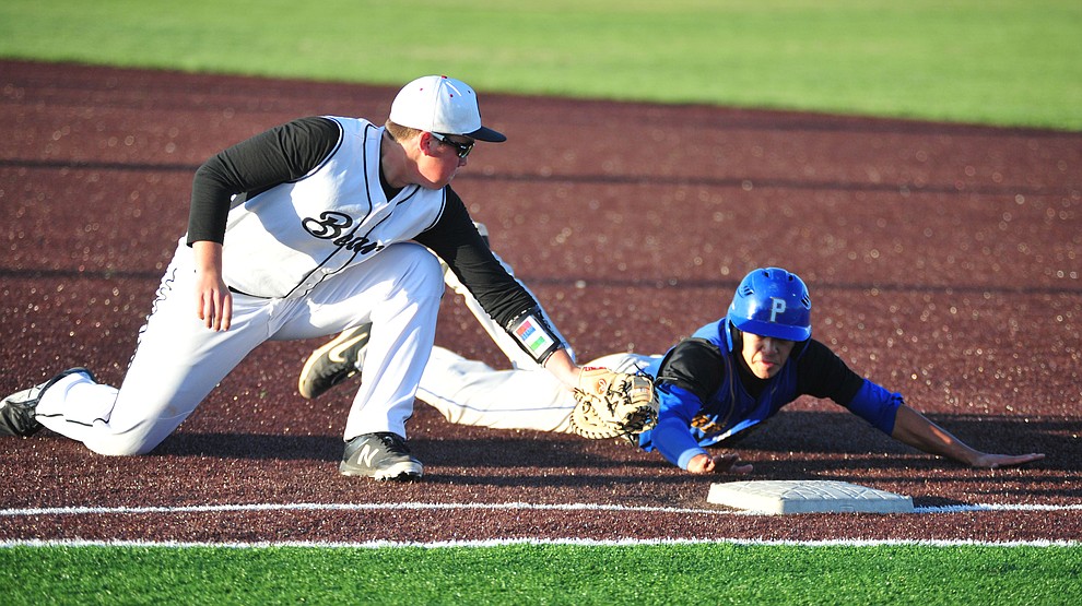 Bradshaw Mountain's Blair Hillig just misses the tag on Ray Chairez as the Bears take on the Prescott Badgers in Prescott Valley Tuesday, April 9.  (Les Stukenberg/Courier)