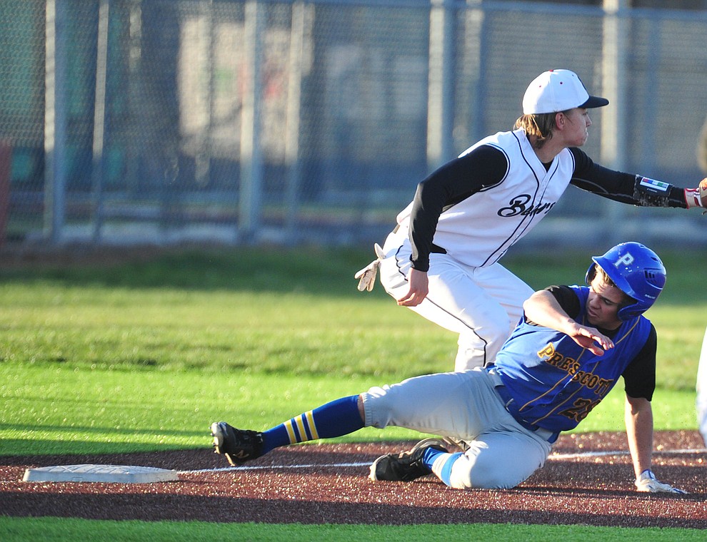Prescott's Ethan Pena slides safely into third under Chase Torp as the Badgers take on the Bradshaw Mountain Bears in Prescott Valley Tuesday, April 9.  (Les Stukenberg/Courier)