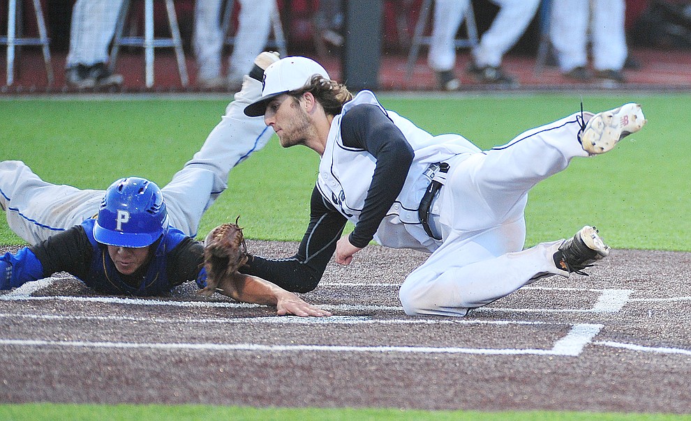 Bradshaw Mountain's Paxton Prentice tags out Ray Chairez as the Bears take on the Prescott Badgers in Prescott Valley Tuesday, April 9.  (Les Stukenberg/Courier)