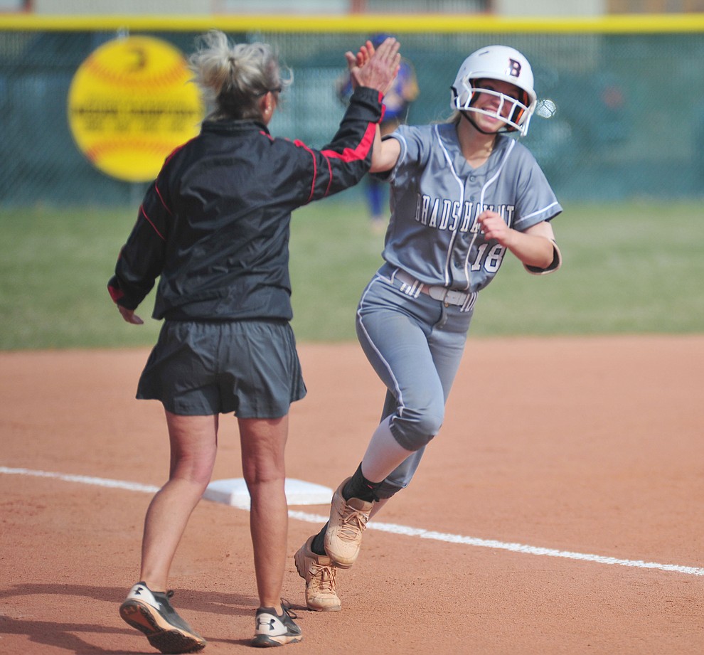 Bradshaw Mountain's Kassidy Outlaw gets congratulated by head coach Sharon Haeese after her leadoff home run in the first inning as the Bears host the Prescott Badgers Thursday, April 11 in Prescott Valley. (Les Stukenberg/Courier)