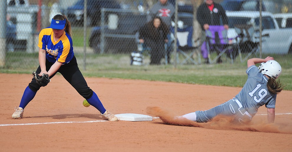 Bradshaw Mountain's Caitlynn Neal slides safely into third on a steal as the Bears host the Prescott Badgers Thursday, April 11 in Prescott Valley. (Les Stukenberg/Courier)